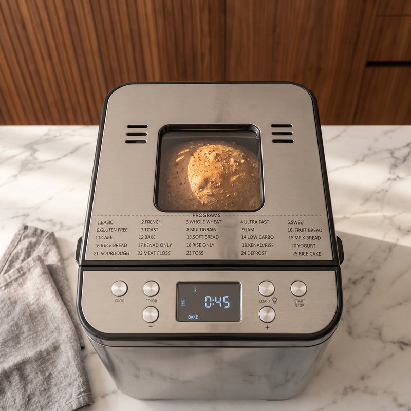 Goudbruin gebakken brood zichtbaar door het kijkvenster van de Oppie broodbakmachine